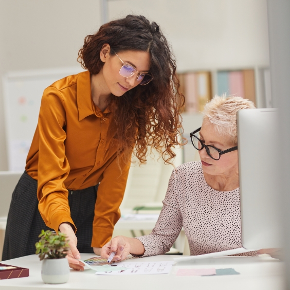 Team members working on contracts